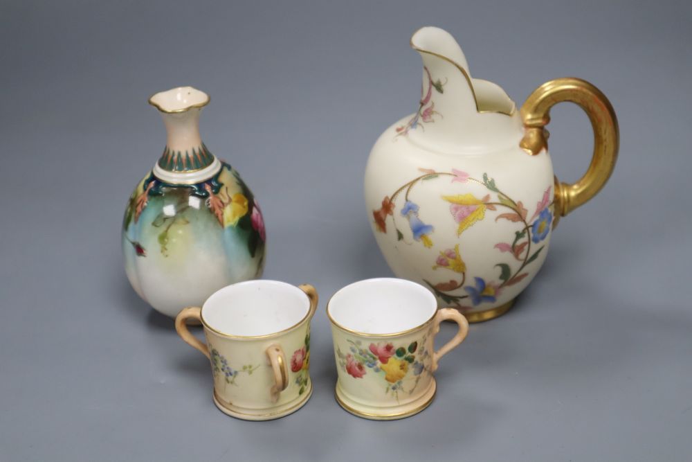 Four small items of Royal Worcester, including a flower-painted vase, No 283, a blush ivory jug, No 1094, a miniature tyg and a mug, ta